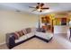 Spacious living room with neutral color palette and ceiling fan at 158 Eppinger Dr, Port Charlotte, FL 33953