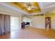 Living room with access to patio and painted ceiling at 158 Eppinger Dr, Port Charlotte, FL 33953