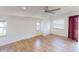 Living room with wood-look floors, ceiling fan, and multiple windows at 158 Eppinger Dr, Port Charlotte, FL 33953