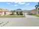 Front exterior view of a house with palm trees and a green lawn at 1688 Piccadilly Cir, Punta Gorda, FL 33980