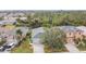 High-angle view of a two-story home with attached garage, driveway, and front yard landscaping at 1796 Scarlett Ave, North Port, FL 34289