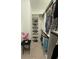 Walk-in closet with custom shelving and rods, providing ample storage space at 1796 Scarlett Ave, North Port, FL 34289