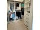 A very well-organized closet with a variety of storage options, including drawers and shelves at 1796 Scarlett Ave, North Port, FL 34289