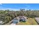 An aerial view of a single-story home surrounded by trees at 18359 Gypsy Ave, Port Charlotte, FL 33954