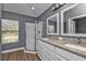 Modern bathroom with dual vanity, granite countertops, and a shower at 18359 Gypsy Ave, Port Charlotte, FL 33954