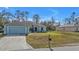 Charming single-story home with a two-car garage and landscaped yard at 18359 Gypsy Ave, Port Charlotte, FL 33954