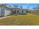 Inviting front yard with a walkway leading to the screened front entryway at 18359 Gypsy Ave, Port Charlotte, FL 33954