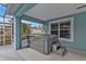 Relax in the covered hot tub adjacent to a large window at 18359 Gypsy Ave, Port Charlotte, FL 33954