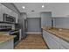 Spacious kitchen with stainless steel appliances and white cabinets at 18359 Gypsy Ave, Port Charlotte, FL 33954