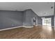 Open concept living and dining area with wood-look floors at 18359 Gypsy Ave, Port Charlotte, FL 33954