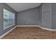 Living room with wood-look floors and vaulted ceiling at 18359 Gypsy Ave, Port Charlotte, FL 33954