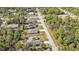 Aerial view of a residential neighborhood with lush trees at 18359 Gypsy Ave, Port Charlotte, FL 33954
