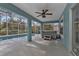 Covered patio with pool, spa, and ceiling fan at 18359 Gypsy Ave, Port Charlotte, FL 33954