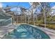 Inviting pool under a screened enclosure with a view of the trees at 18359 Gypsy Ave, Port Charlotte, FL 33954