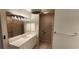 Bright bathroom with white vanity, glass-block shower, and modern fixtures at 197 Tropicana Dr # 1512, Punta Gorda, FL 33950