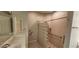 Bathroom featuring a unique glass block shower, white vanity, and tile flooring at 197 Tropicana Dr # 1512, Punta Gorda, FL 33950