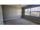 Bedroom with a window overlooking water, plush carpeting, and a ceiling fan at 197 Tropicana Dr # 1512, Punta Gorda, FL 33950