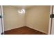 Empty bedroom with wood-look flooring and a modern light fixture at 197 Tropicana Dr # 1512, Punta Gorda, FL 33950