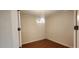 Bonus room with wood-look flooring and a modern light fixture at 197 Tropicana Dr # 1512, Punta Gorda, FL 33950