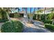 Paved walkway through landscaped common area towards community pool at 197 Tropicana Dr # 1512, Punta Gorda, FL 33950