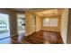 Dining area with wood floors, a unique light fixture, and views of the kitchen and patio at 197 Tropicana Dr # 1512, Punta Gorda, FL 33950