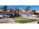 Townhome exterior with tile roof, attached two-car garages, and landscaped yard at 197 Tropicana Dr # 1512, Punta Gorda, FL 33950