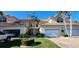 Attractive two-story townhome with tile roof, attached garages, and lush landscaping at 197 Tropicana Dr # 1512, Punta Gorda, FL 33950
