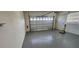 Garage interior with gray epoxy floor and white walls at 197 Tropicana Dr # 1512, Punta Gorda, FL 33950