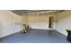 Garage interior with storage shelves, epoxy floor, and ceiling fan at 197 Tropicana Dr # 1512, Punta Gorda, FL 33950