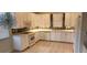 White kitchen cabinets, mosaic tile backsplash, and stainless steel appliances at 197 Tropicana Dr # 1512, Punta Gorda, FL 33950