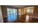 Living area with wood-look flooring, sliding glass doors leading to a patio, and water view at 197 Tropicana Dr # 1512, Punta Gorda, FL 33950