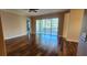 Spacious living room with wood floors and sliding glass doors leading to a patio at 197 Tropicana Dr # 1512, Punta Gorda, FL 33950
