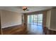 Living room with wood floors, sliding doors to a patio with water views, and neutral walls at 197 Tropicana Dr # 1512, Punta Gorda, FL 33950