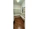 Spacious pantry with ample white shelves and wood-look flooring at 197 Tropicana Dr # 1512, Punta Gorda, FL 33950