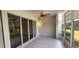 Screened patio with tile flooring and sliding glass doors at 197 Tropicana Dr # 1512, Punta Gorda, FL 33950