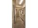 Spacious walk-in closet with white built-in shelves, drawers, and carpeted flooring at 197 Tropicana Dr # 1512, Punta Gorda, FL 33950