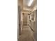 Large, empty walk-in closet with built-in shelving, drawers, and carpeted flooring at 197 Tropicana Dr # 1512, Punta Gorda, FL 33950