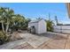 Landscaped backyard with storage shed and grill area at 23309 Hartley Ave, Port Charlotte, FL 33954