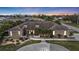 A beautiful one story home at dusk featuring a concrete walkway, desert landscaping, and a prominent front entrance at 23309 Hartley Ave, Port Charlotte, FL 33954