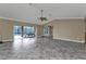 Living room with sliders opening to the pool area at 23309 Hartley Ave, Port Charlotte, FL 33954