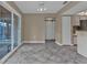 Open living area with sliding glass doors to the pool; features neutral colors and tile flooring at 23309 Hartley Ave, Port Charlotte, FL 33954