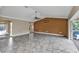 Open living room featuring tiled floors and sliding glass door at 23309 Hartley Ave, Port Charlotte, FL 33954