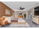 Staged main bedroom suite with stylish decor, TV, and ensuite bath at 23309 Hartley Ave, Port Charlotte, FL 33954
