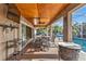 Covered patio, outdoor dining, and a view of the inviting pool at 23309 Hartley Ave, Port Charlotte, FL 33954