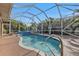 Inviting kidney-shaped pool with screened enclosure at 23309 Hartley Ave, Port Charlotte, FL 33954