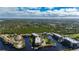 Aerial close-up focuses on the apartment complex's rooftop and position amidst canals at 25188 Marion Ave # A108, Punta Gorda, FL 33950