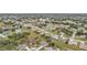 An aerial view of a residential neighborhood with houses, trees, and green spaces at 26090 Huanuco Dr, Punta Gorda, FL 33983