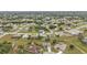 Aerial view of a residential area with several houses at 26090 Huanuco Dr, Punta Gorda, FL 33983