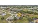 Aerial view of a residential neighborhood with houses and yards at 26090 Huanuco Dr, Punta Gorda, FL 33983