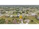 Aerial view of the property in a residential neighborhood at 26090 Huanuco Dr, Punta Gorda, FL 33983
